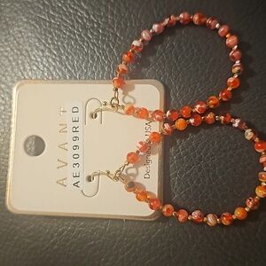 Red and gold hoop earrings
